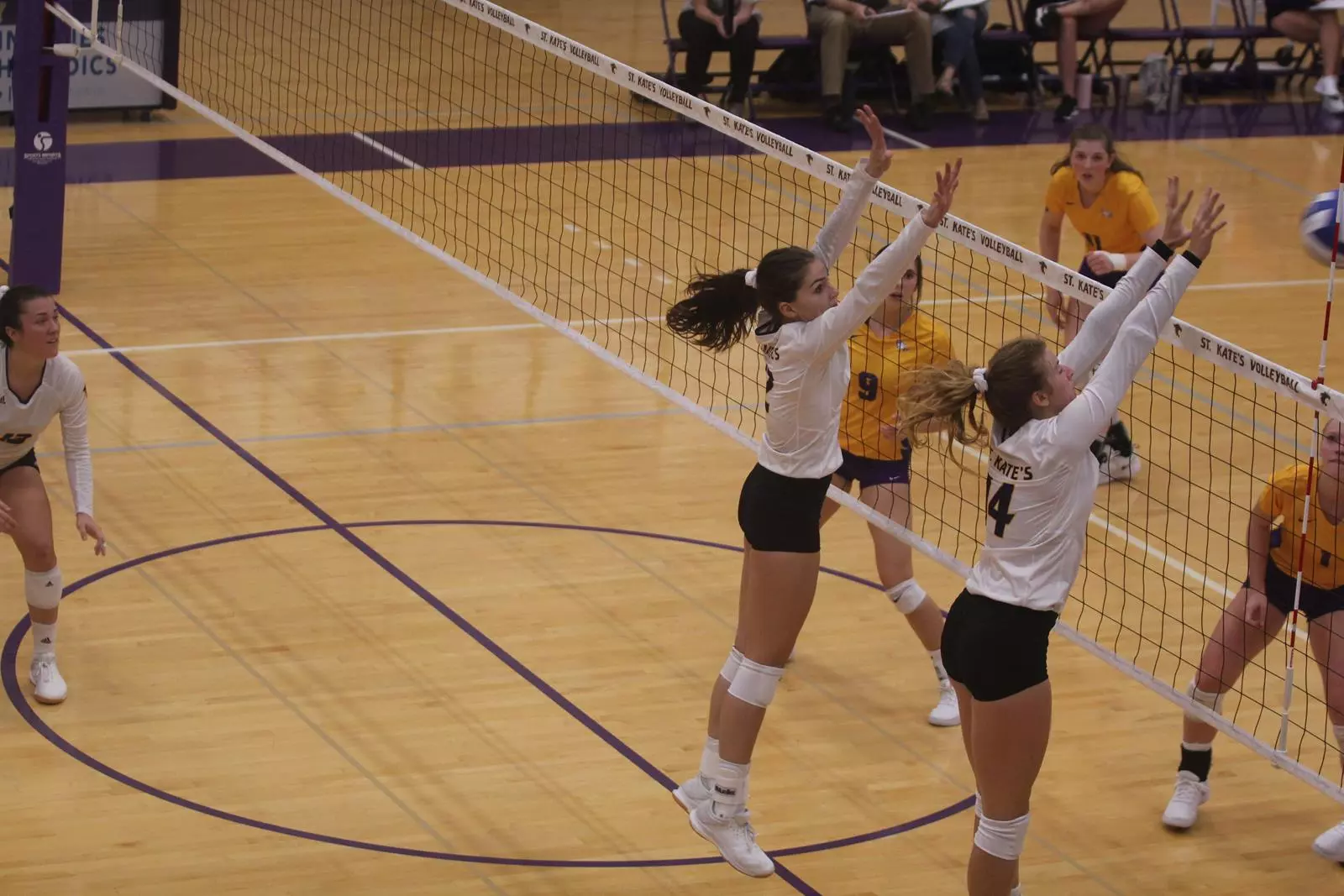 Erin Tebben and Bry Leverentz Jumping to Block Ball