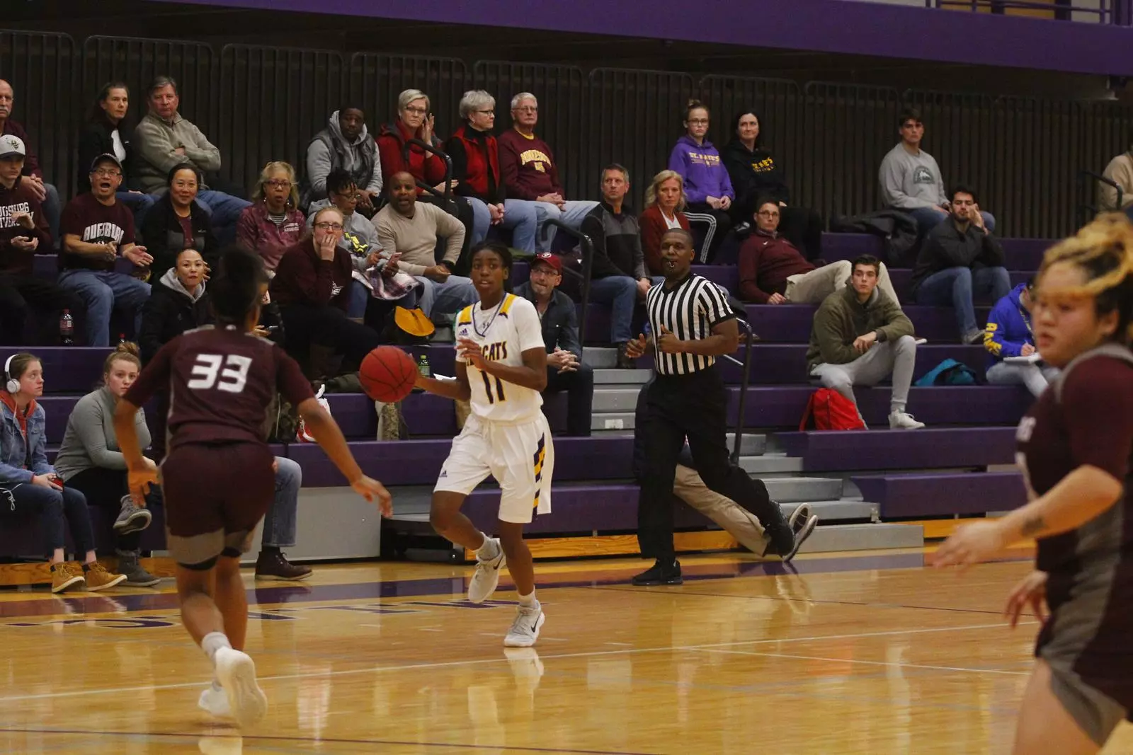 Danica Cambrice dribbiling the ball down the court. 