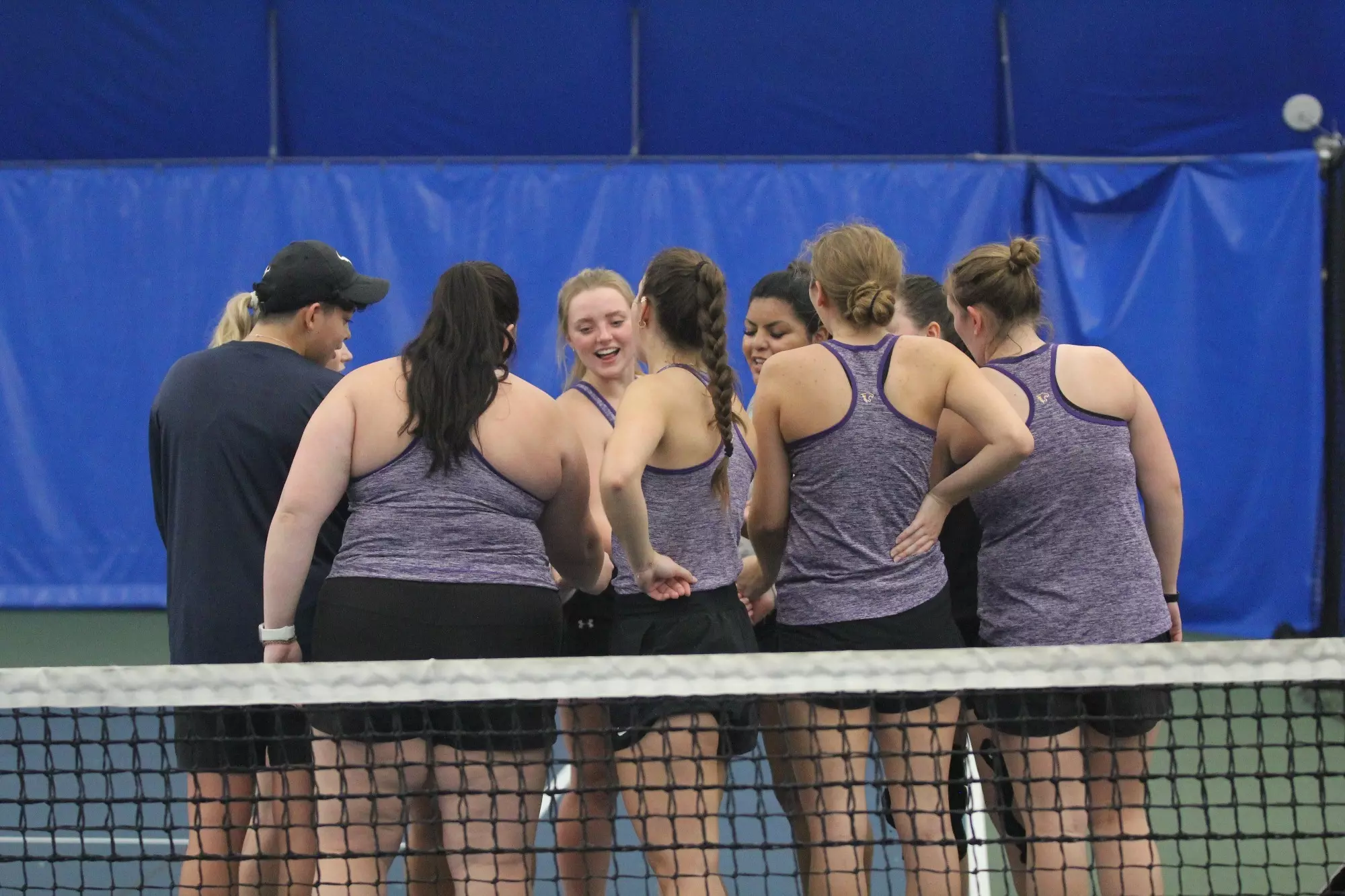 Tennis team huddle at InnerCity Tennis