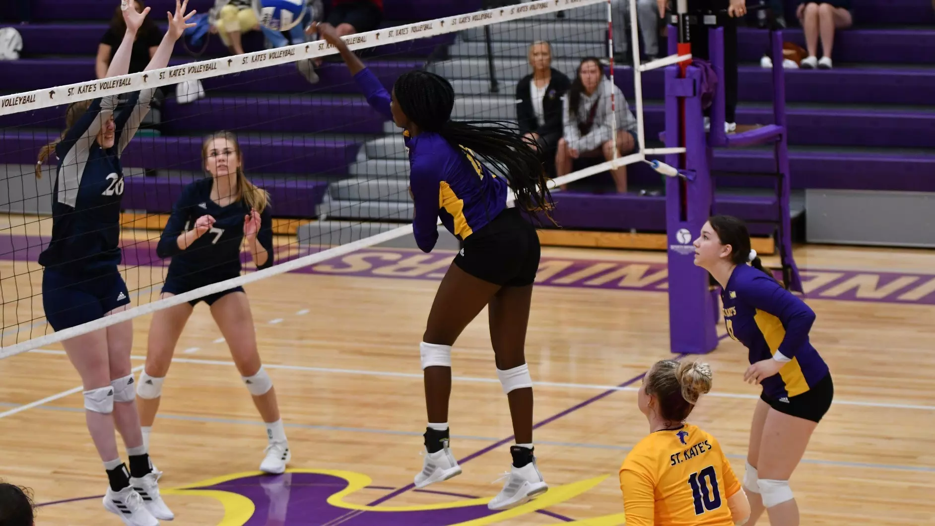 Madison Fagan attacking the volleyball at the net