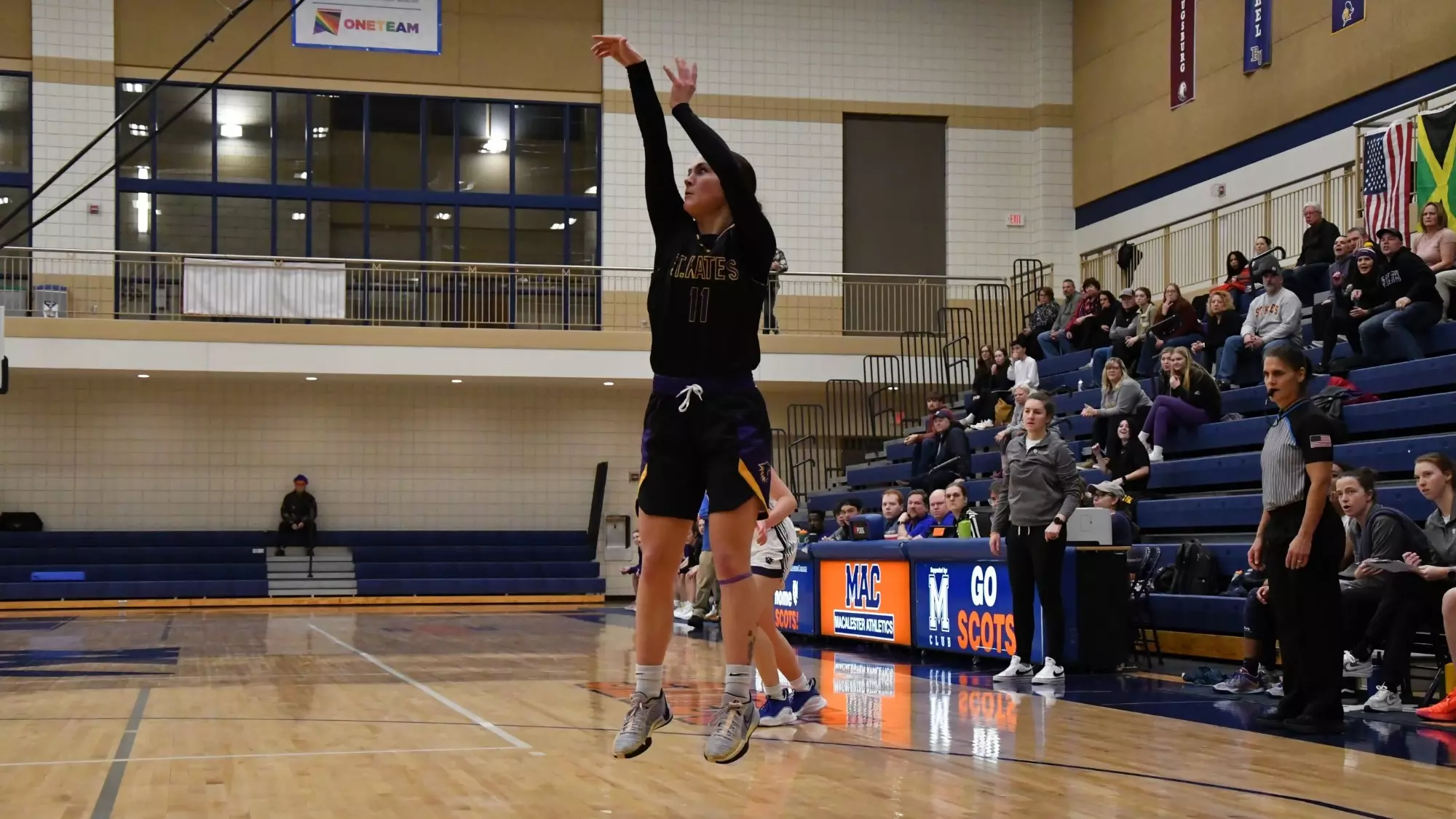Karis Zezza shooting basketball at Macalester