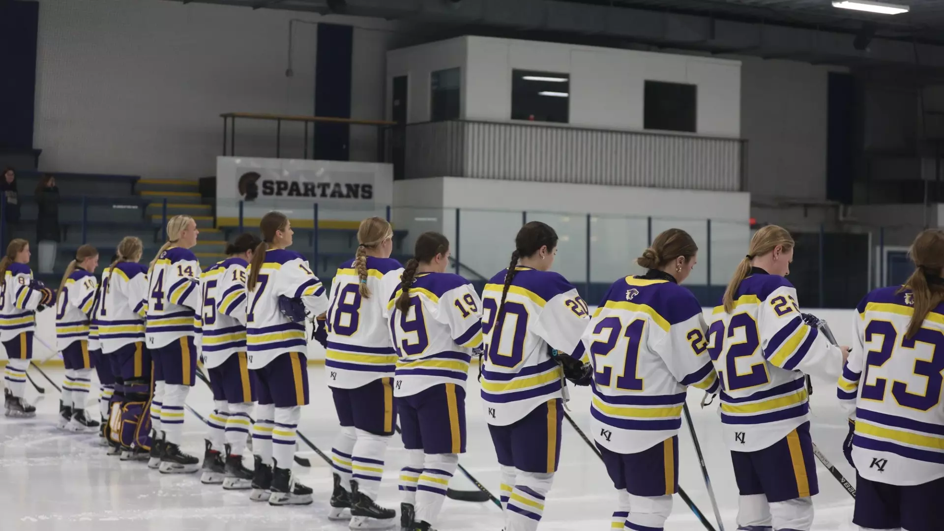 Hockey team lined up on blue line