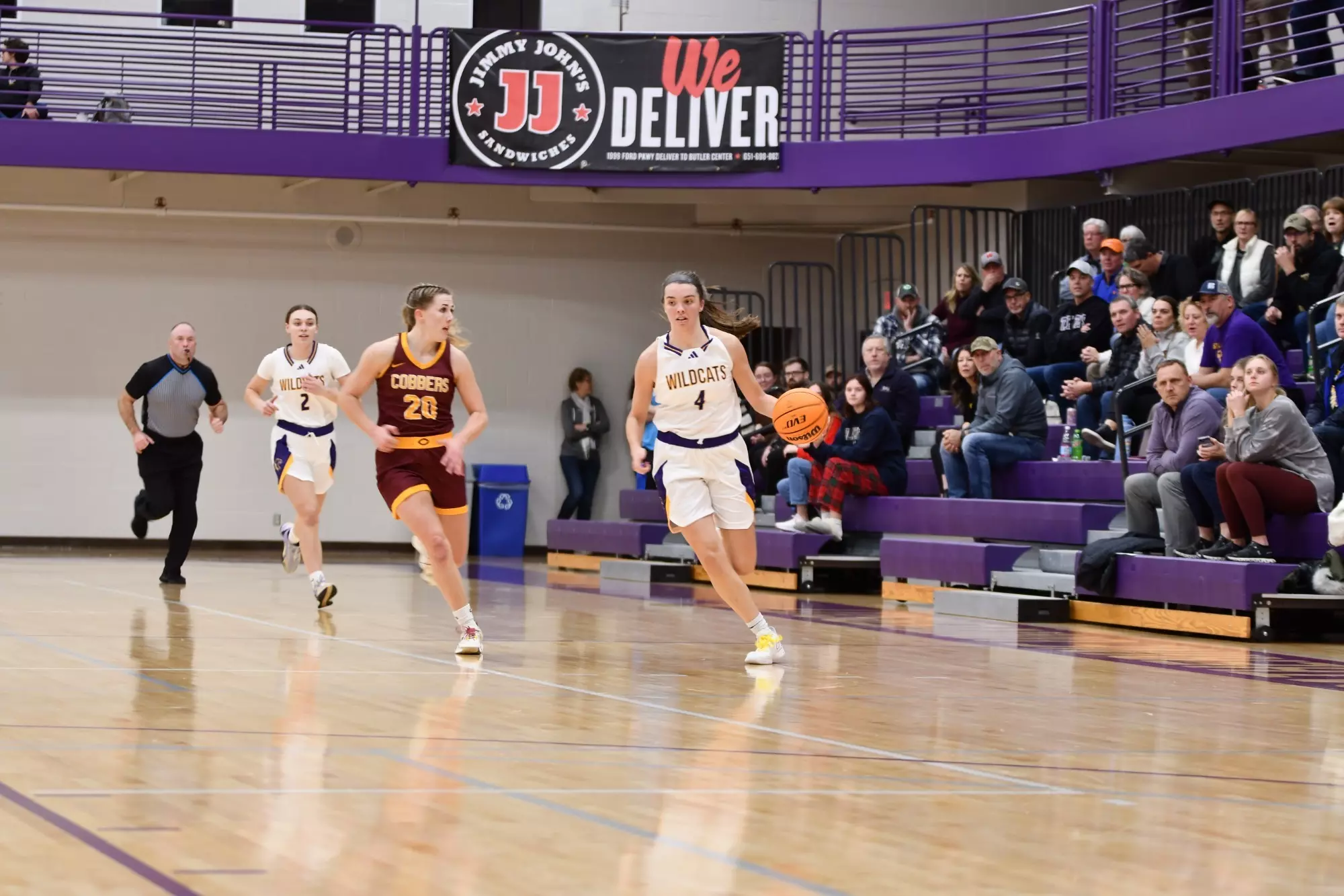 Greta dribbling down the court